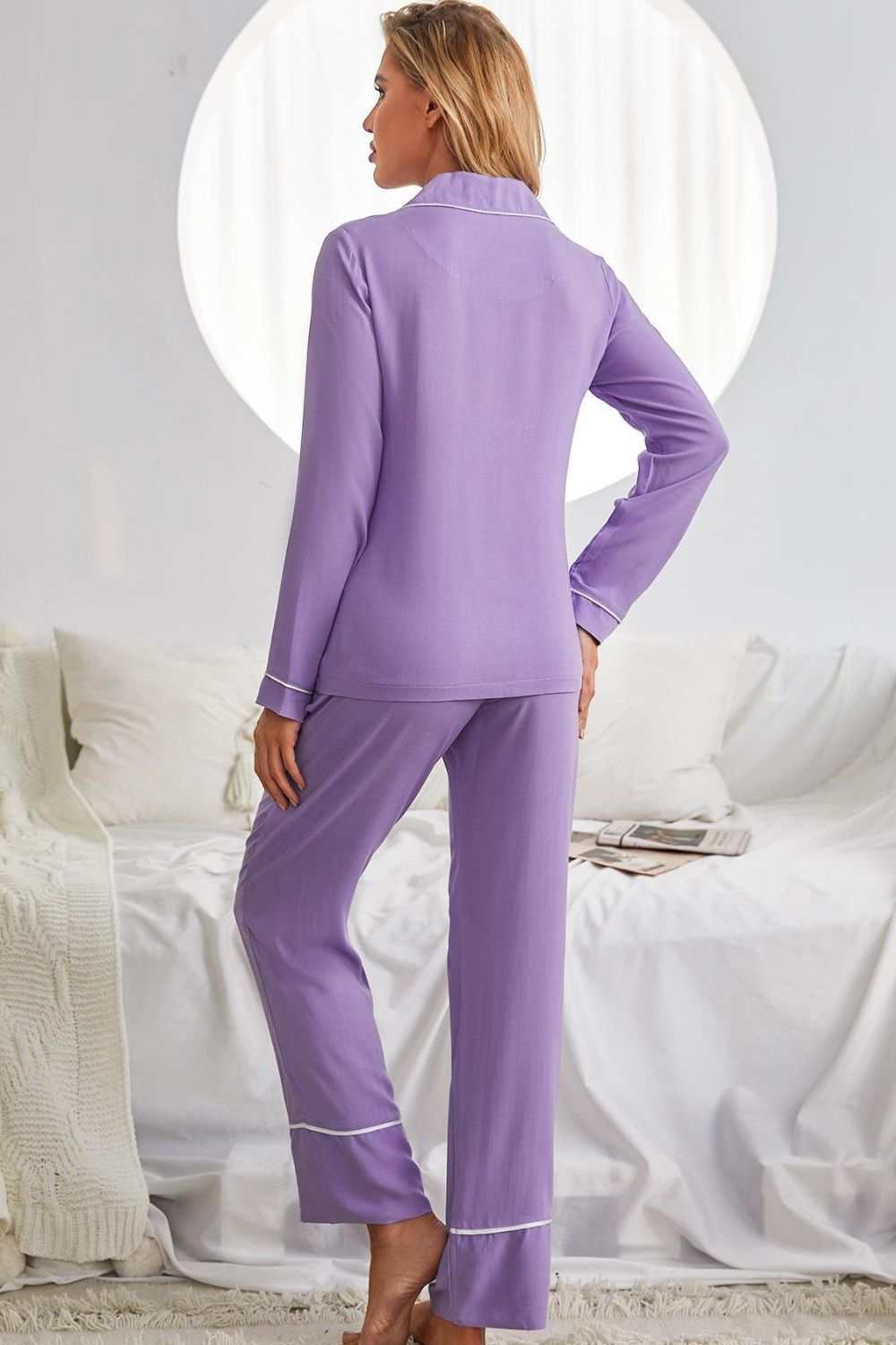 Minimalist violet pajama set with contrast lapel collar, long sleeves, and pockets, made from viscose.