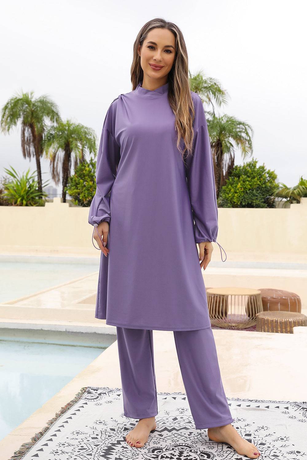 Cap, Drawstring Mock Neck Long Sleeve Top and Pants Swim Set in purple, three-piece, highly stretchy material.