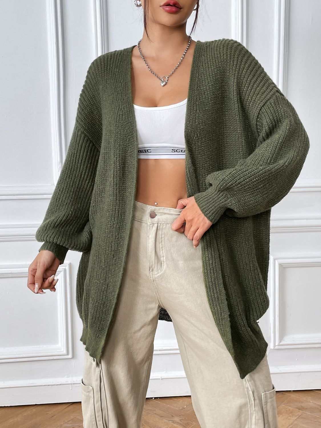 Open front long sleeve cardigan in green, featuring a basic style with moderate stretch, made from 100% polyester.