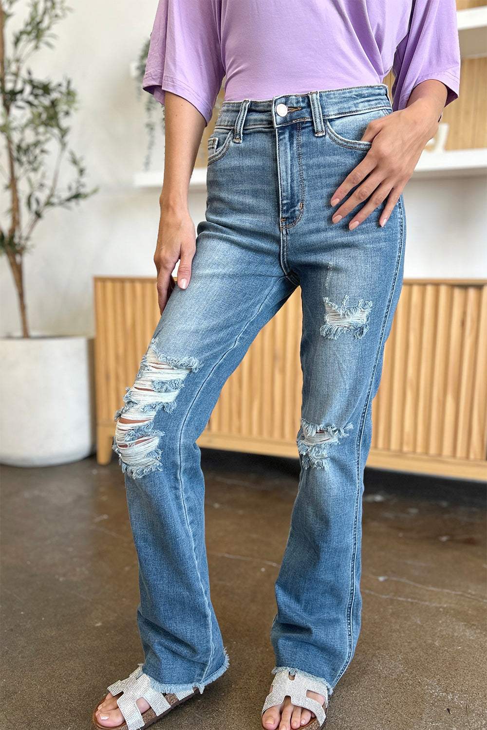 Judy Blue full size distressed raw hem bootcut jeans, blue denim with edgy distressing and raw hem, perfect for casual style.