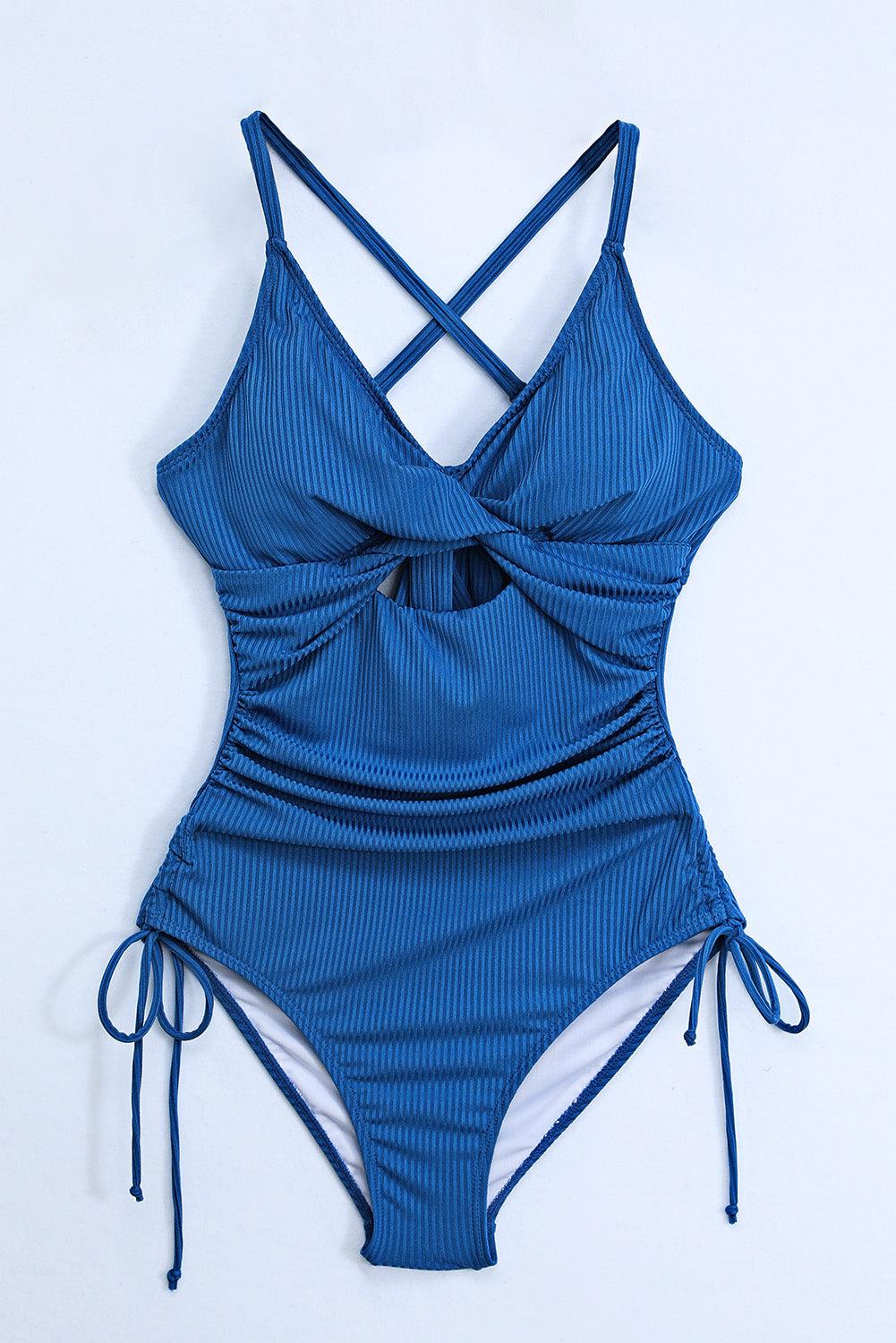 Cutout V-Neck spaghetti strap one-piece swimwear with crisscross design and removable padding.