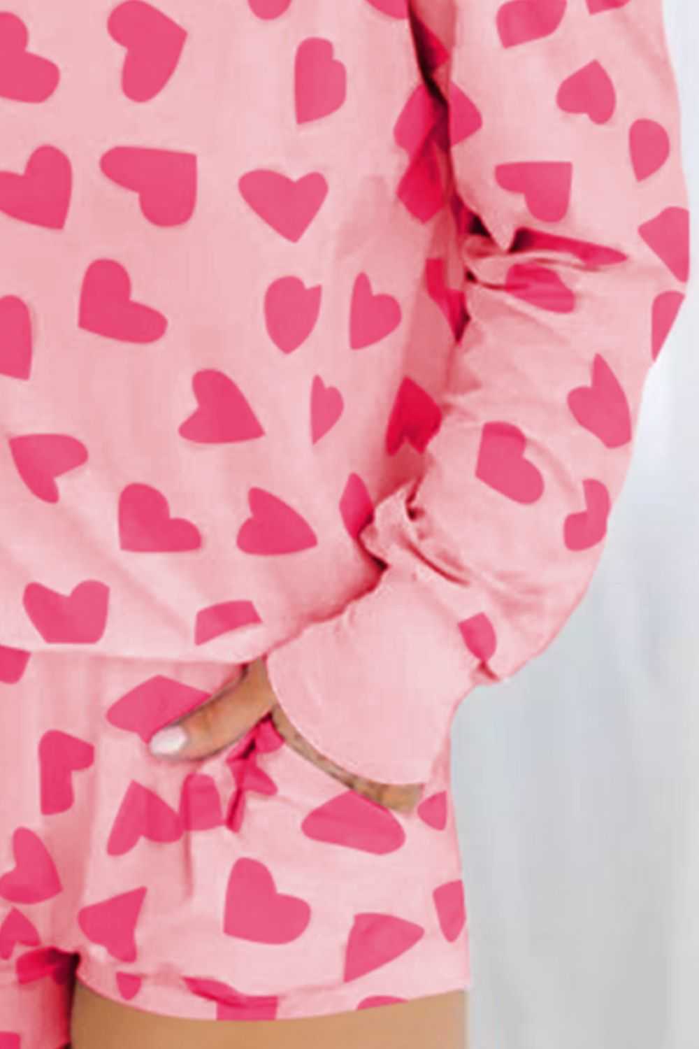 Heart print round neck top and shorts lounge set in pink, slightly stretchy fabric.