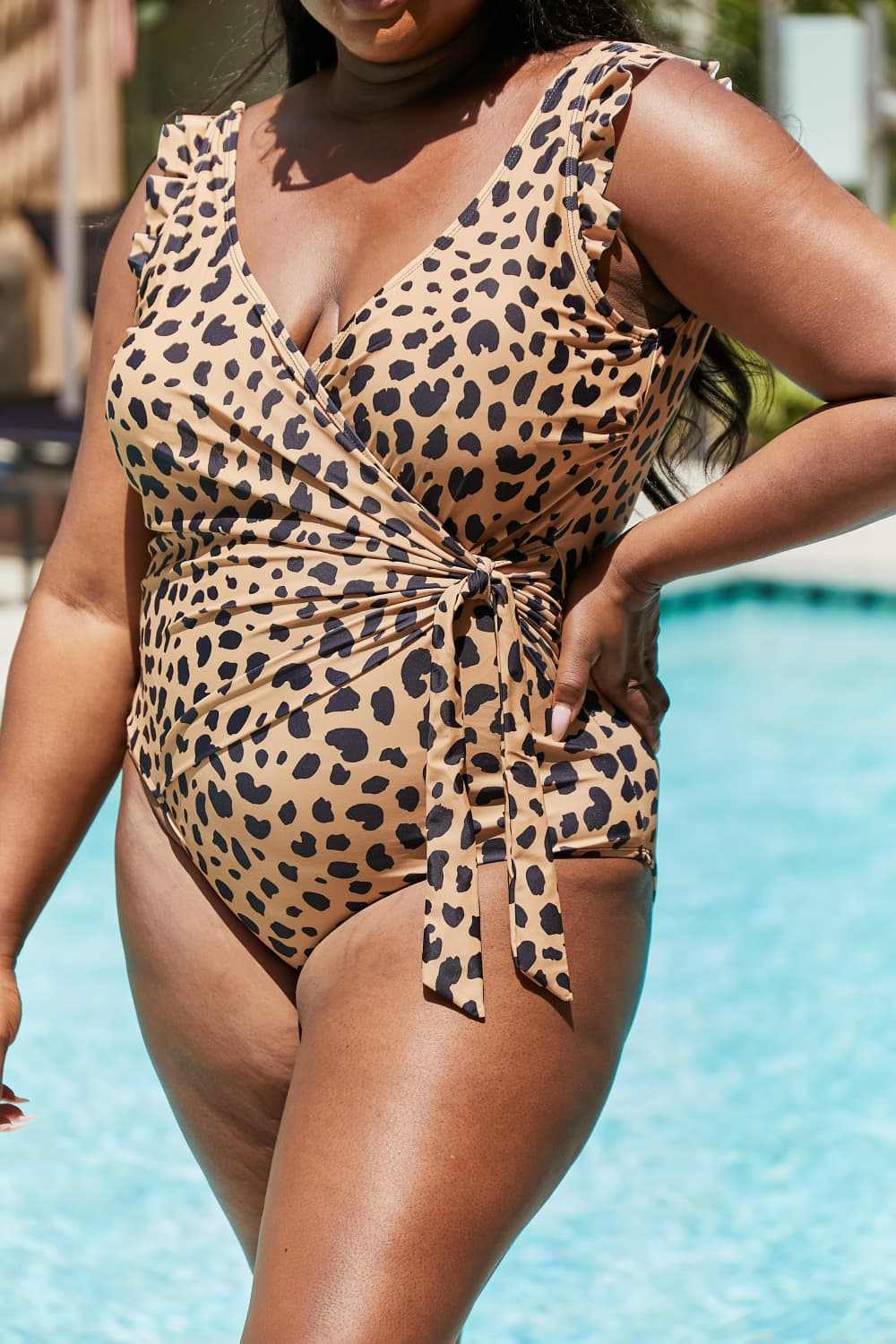 Leopard print one-piece swimsuit with ruffle faux wrap design by Marina West Swim.