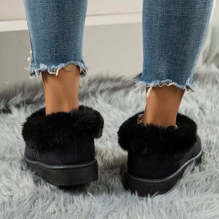 Thermal fuzzy tied round toe boots in black, flat heel, worn with jeans.