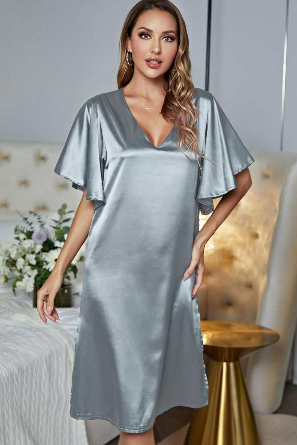 Satin V-neck night dress with flutter sleeves and side slit.