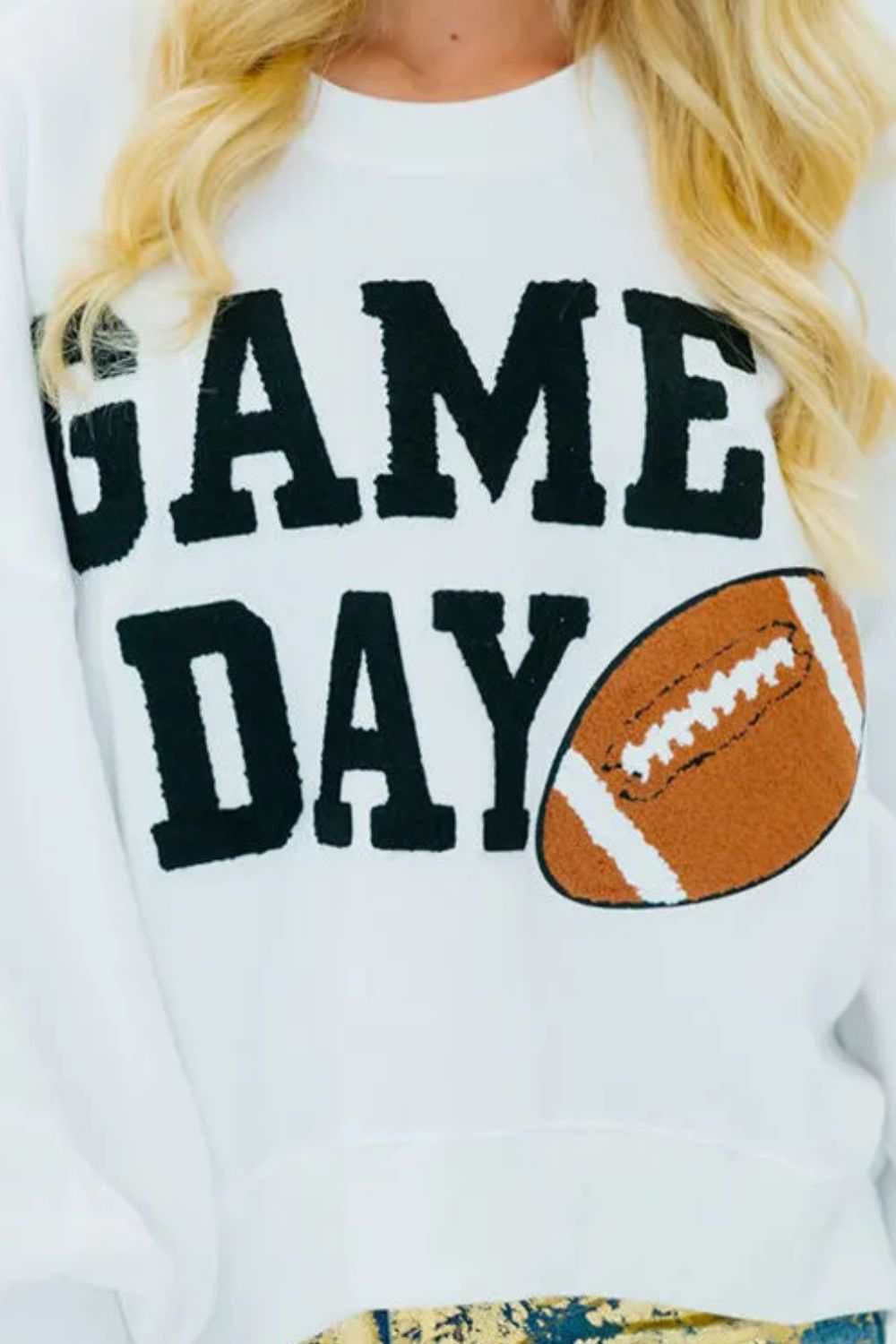 GAME DAY round neck long sleeve sweatshirt with football graphic.