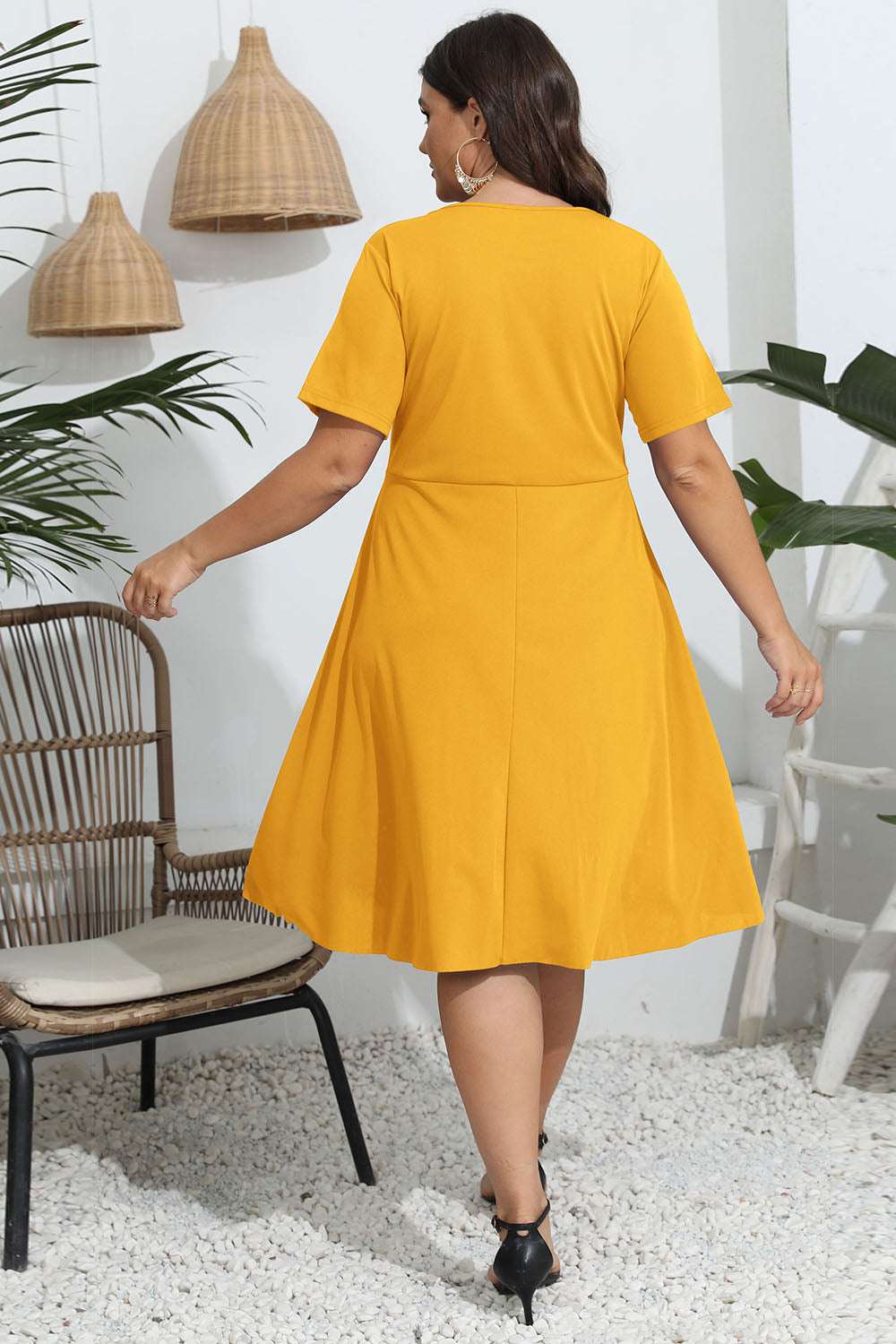 Plus size round neck openwork dress in yellow with a slightly stretchy fit.