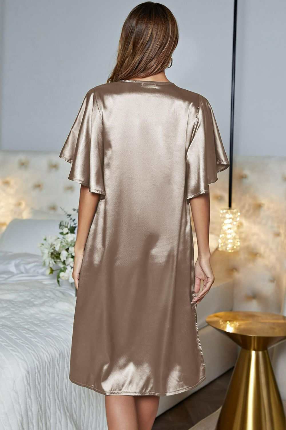 Satin night dress with flutter sleeves and side slit, V-neck design.