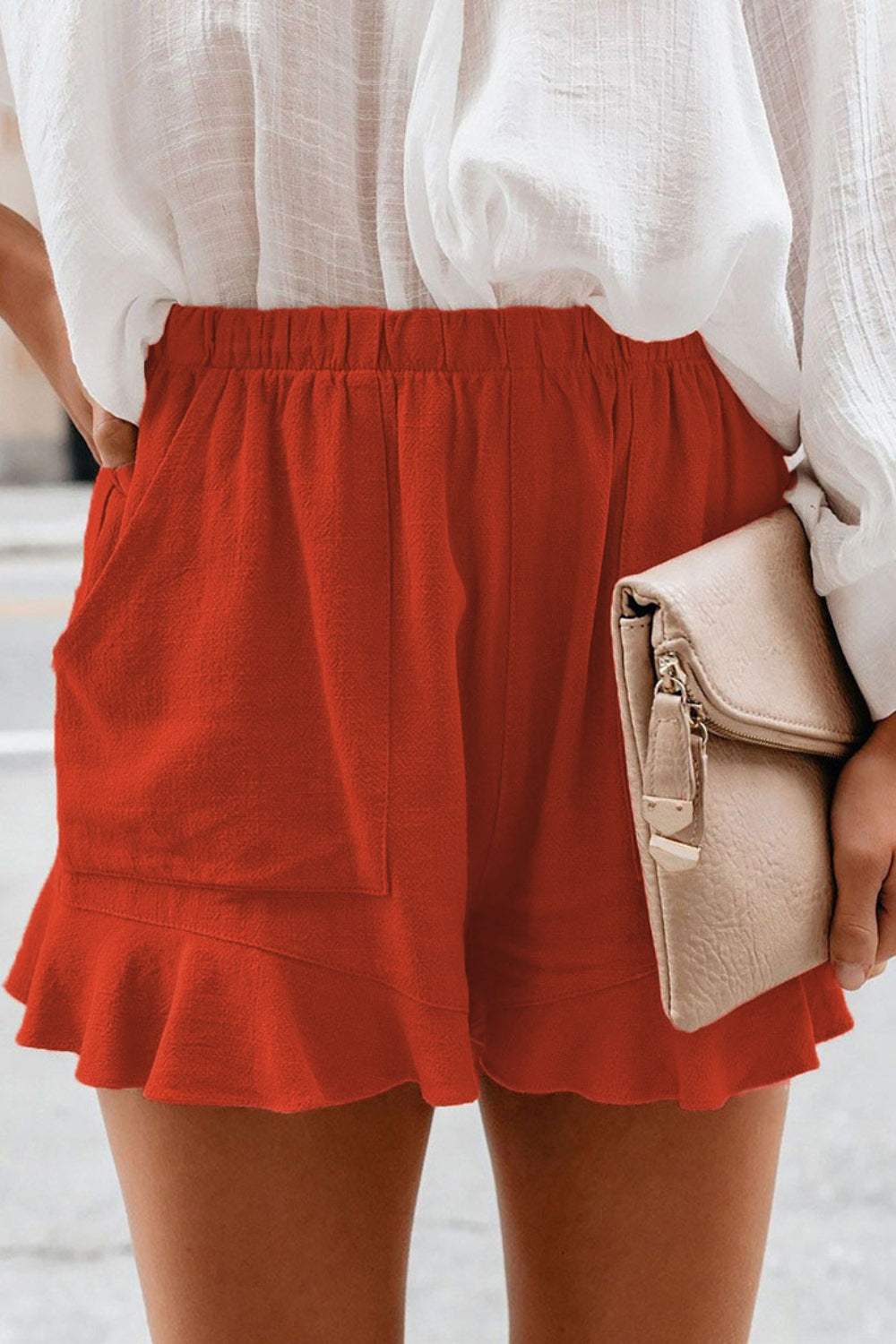 Full Size Ruffled Elastic Waist Shorts in red with a ruffled hem detail.