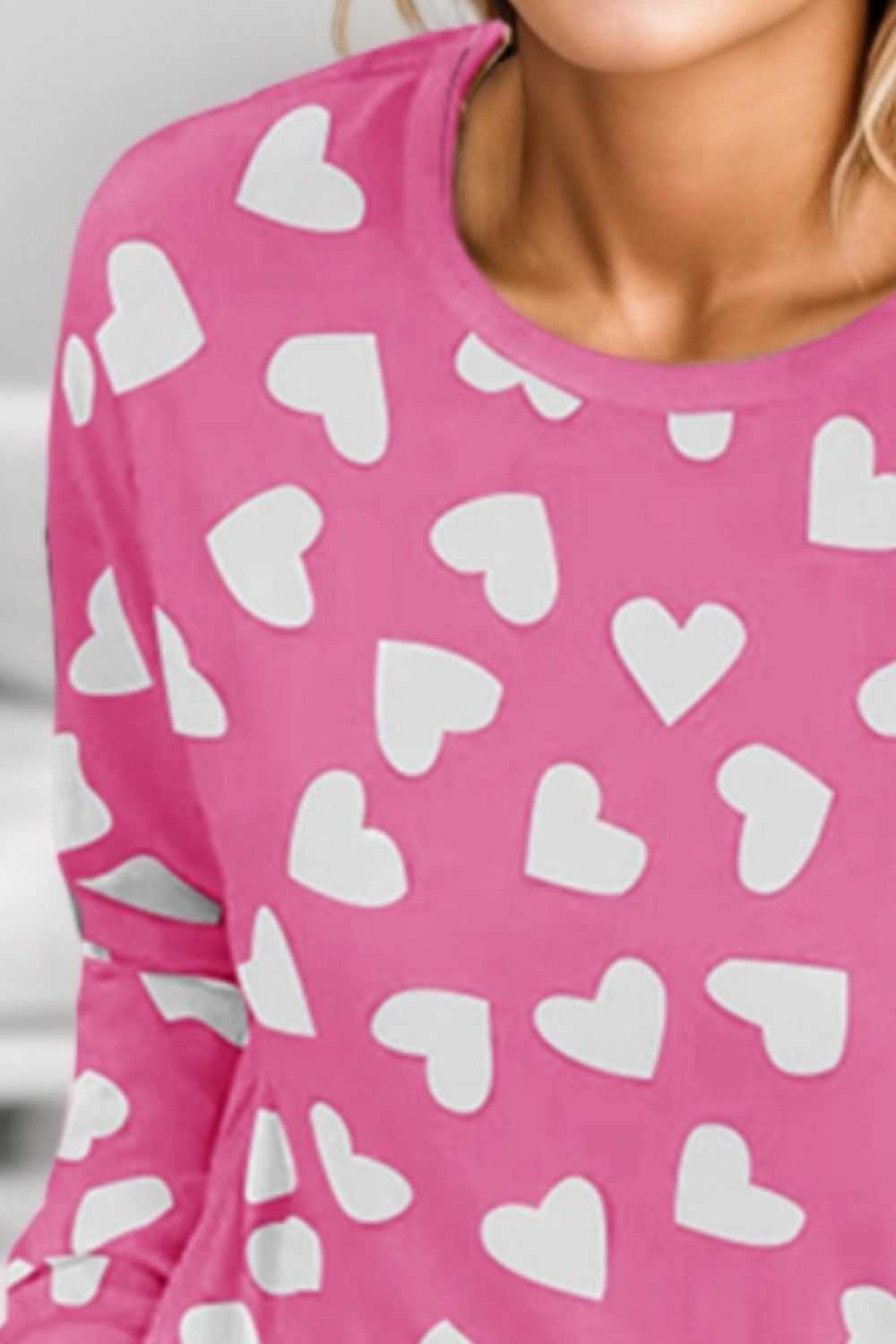 Heart print round neck lounge set with pink top and shorts.