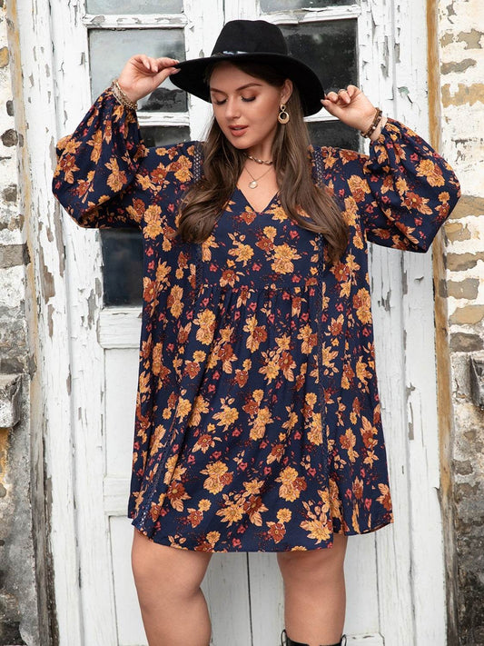 Plus Size Floral V-Neck Balloon Sleeve Dress in navy with orange floral pattern.