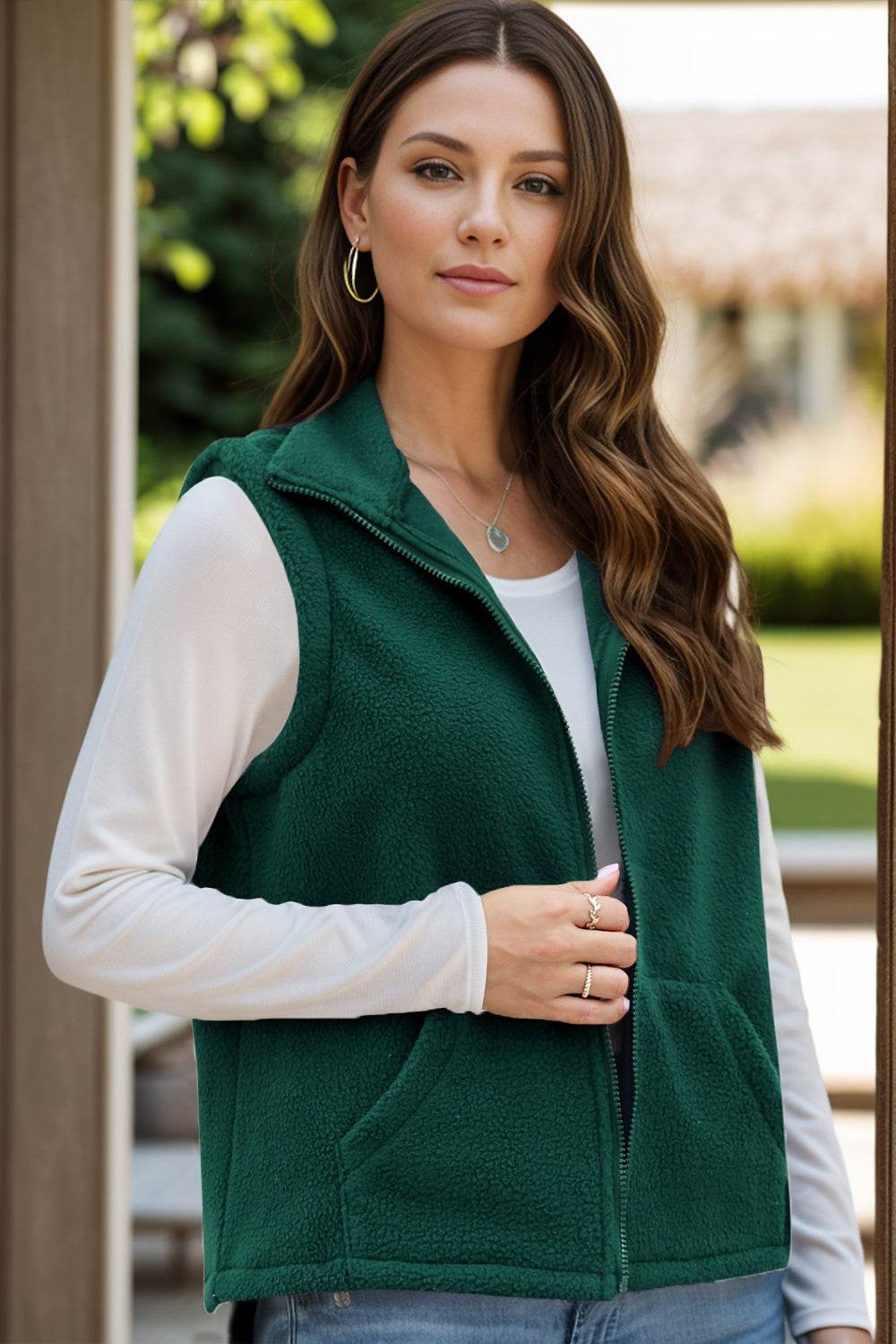 Green zip up vest coat with pockets, made of 95% polyester and 5% spandex, suitable for casual wear.