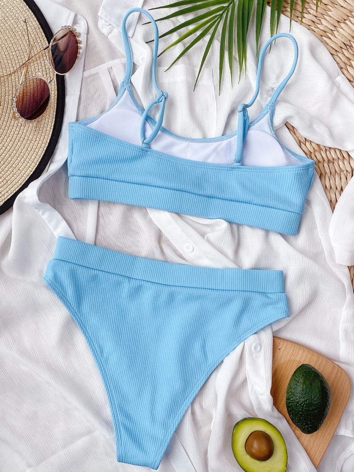 Blue scoop neck spaghetti strap two-piece swim set with removable padding.