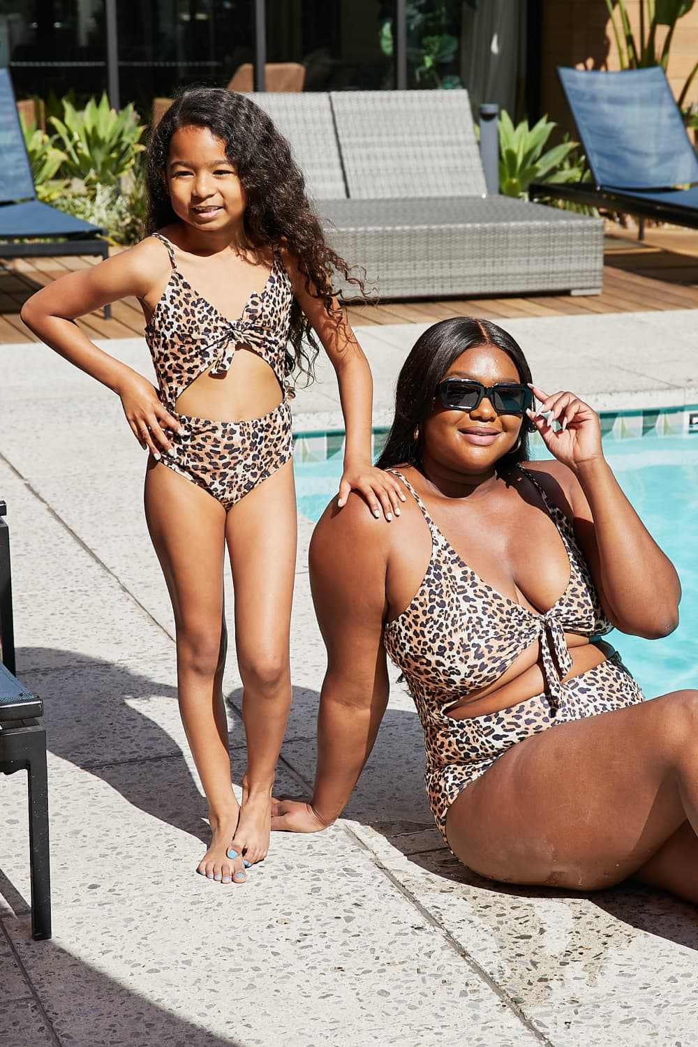 Leopard print cutout one-piece swimsuit from Marina West Swim Lost collection by the pool.