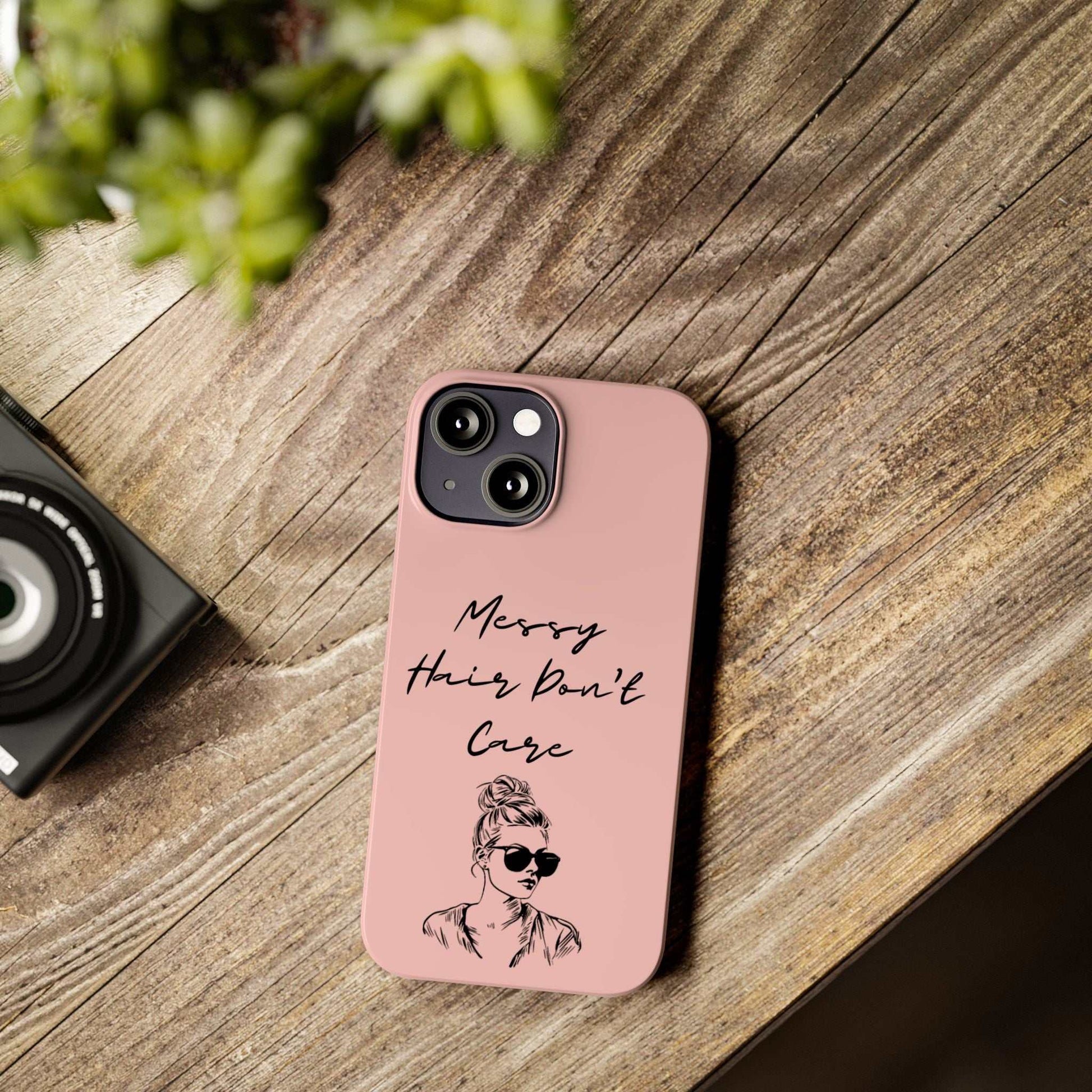 Baby pink phone case with "Messy Hair, Don't Care" quote and girl illustration, trendy and durable.