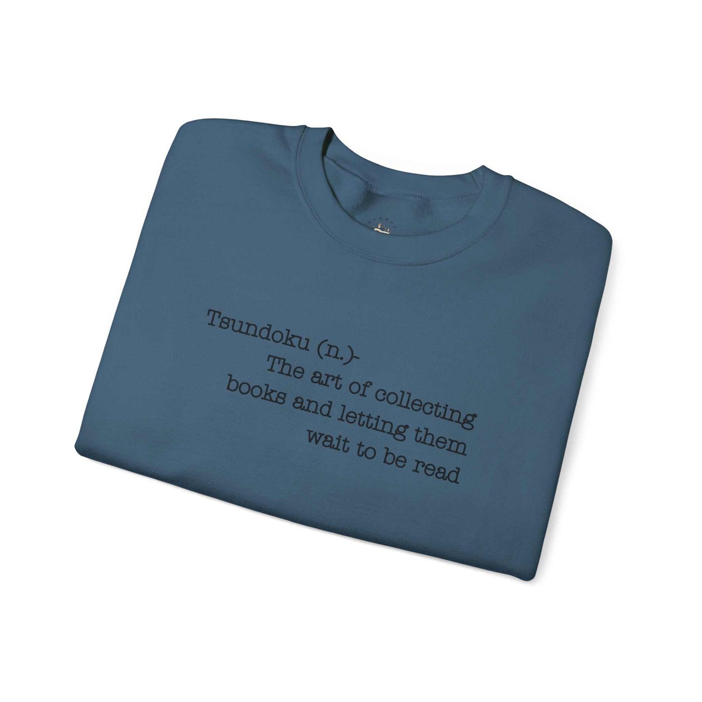 "Tsundoku" Crewneck Sweatshirt, blue color, with text: "Tsundoku (n.) The art of collecting books and letting them wait to be read."