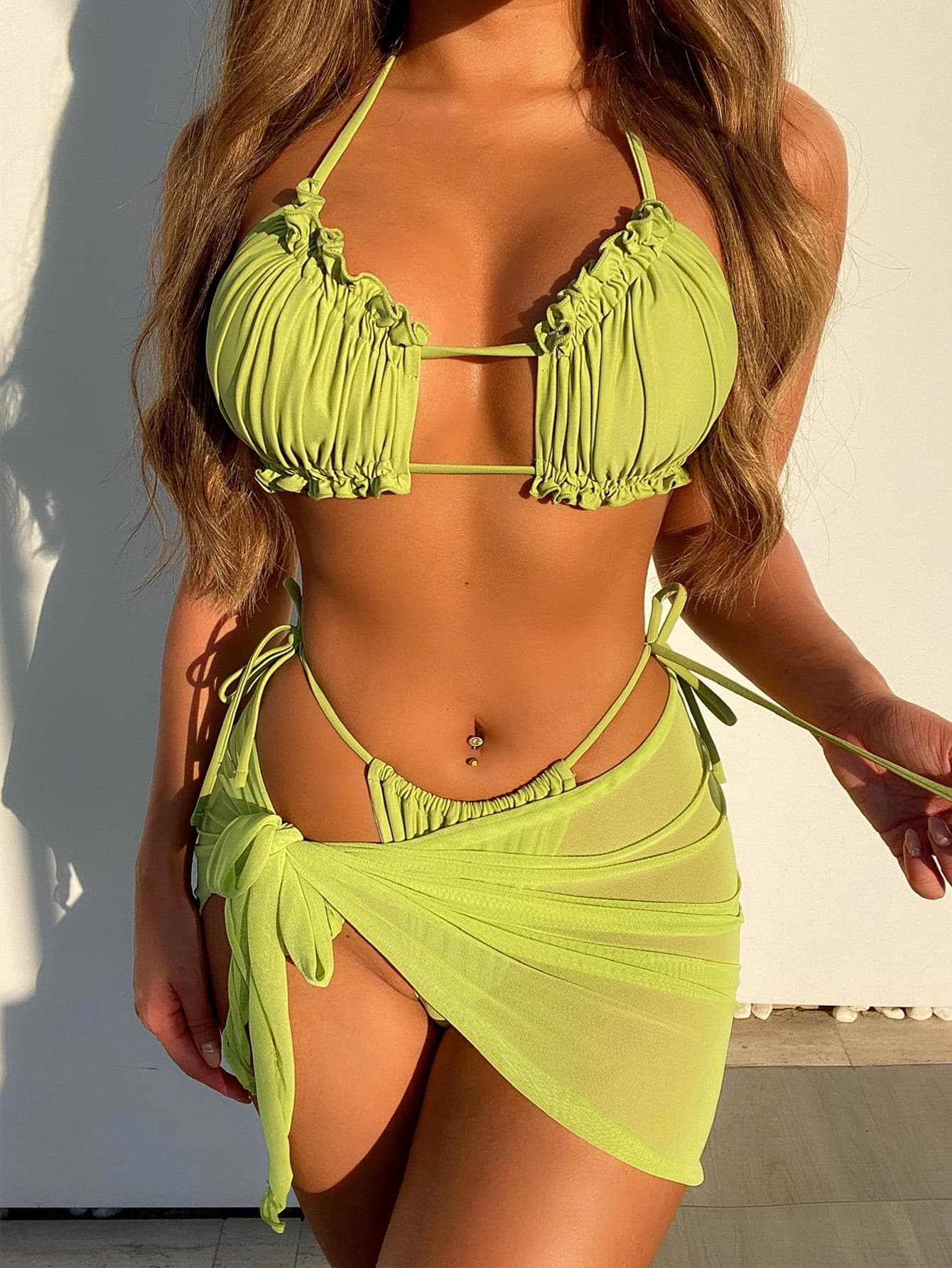 Frill Trill halter neck three-piece swim set with tie-side bikini and removable padding in solid tropical green.