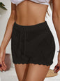 Black drawstring cutout swim shorts with stretchy fabric and stylish design.