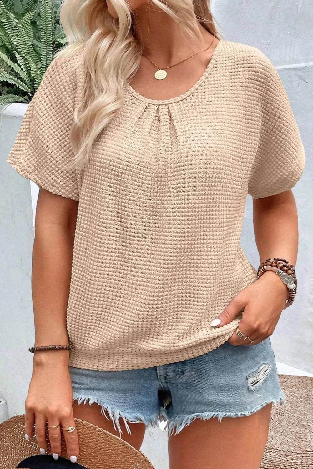 Plus size textured lace round neck short sleeve t-shirt in beige.