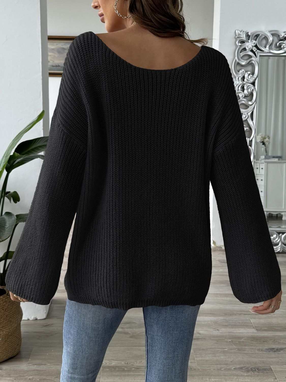 Bow Boat Neck Long Sleeve Sweater in black, featuring a basic style with slightly stretchy 100% polyester material.