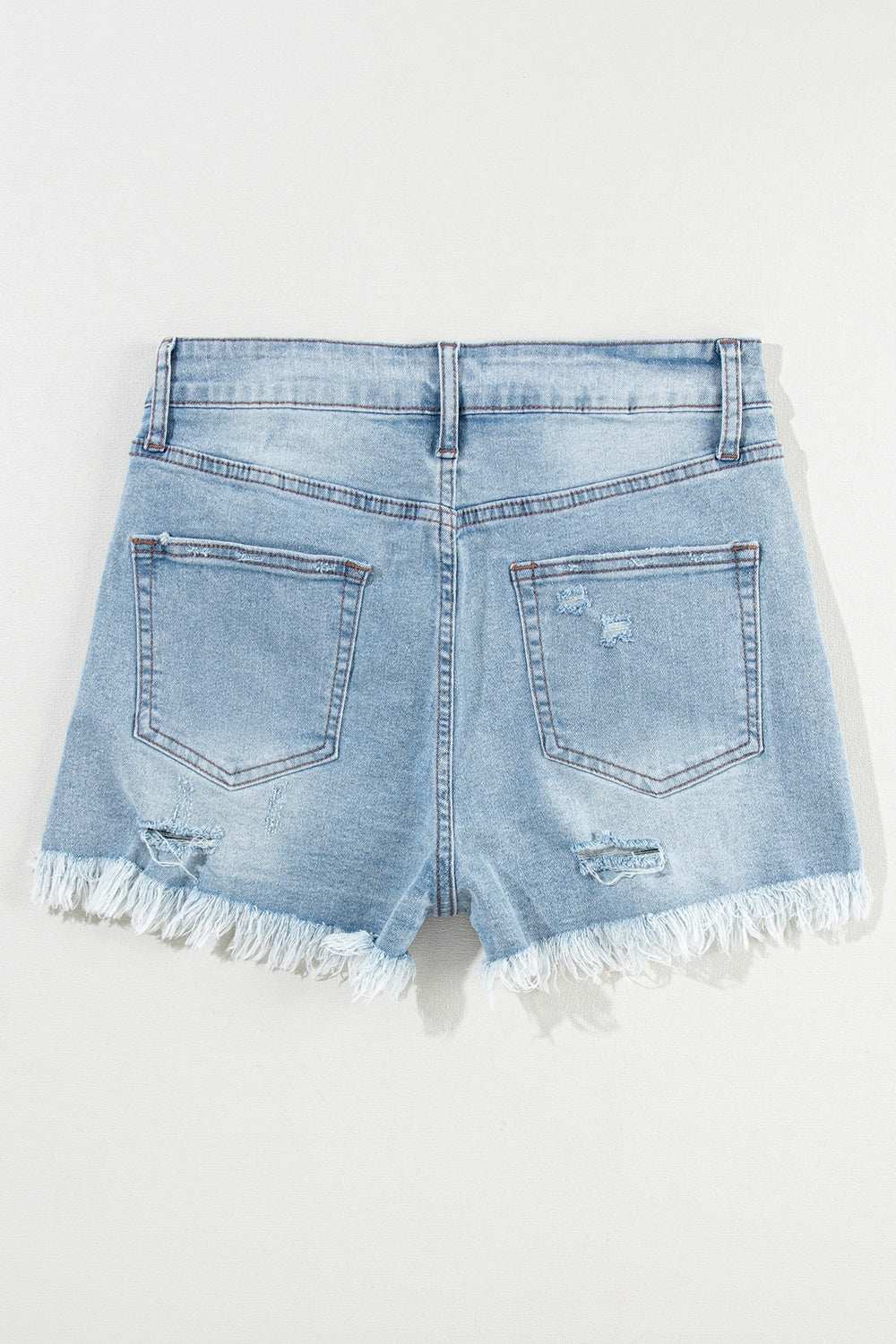 Distressed raw hem denim shorts with slight stretch and back pockets.