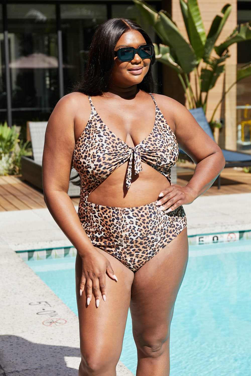 Leopard print cutout one-piece swimsuit with plunging neckline by Marina West Swim.