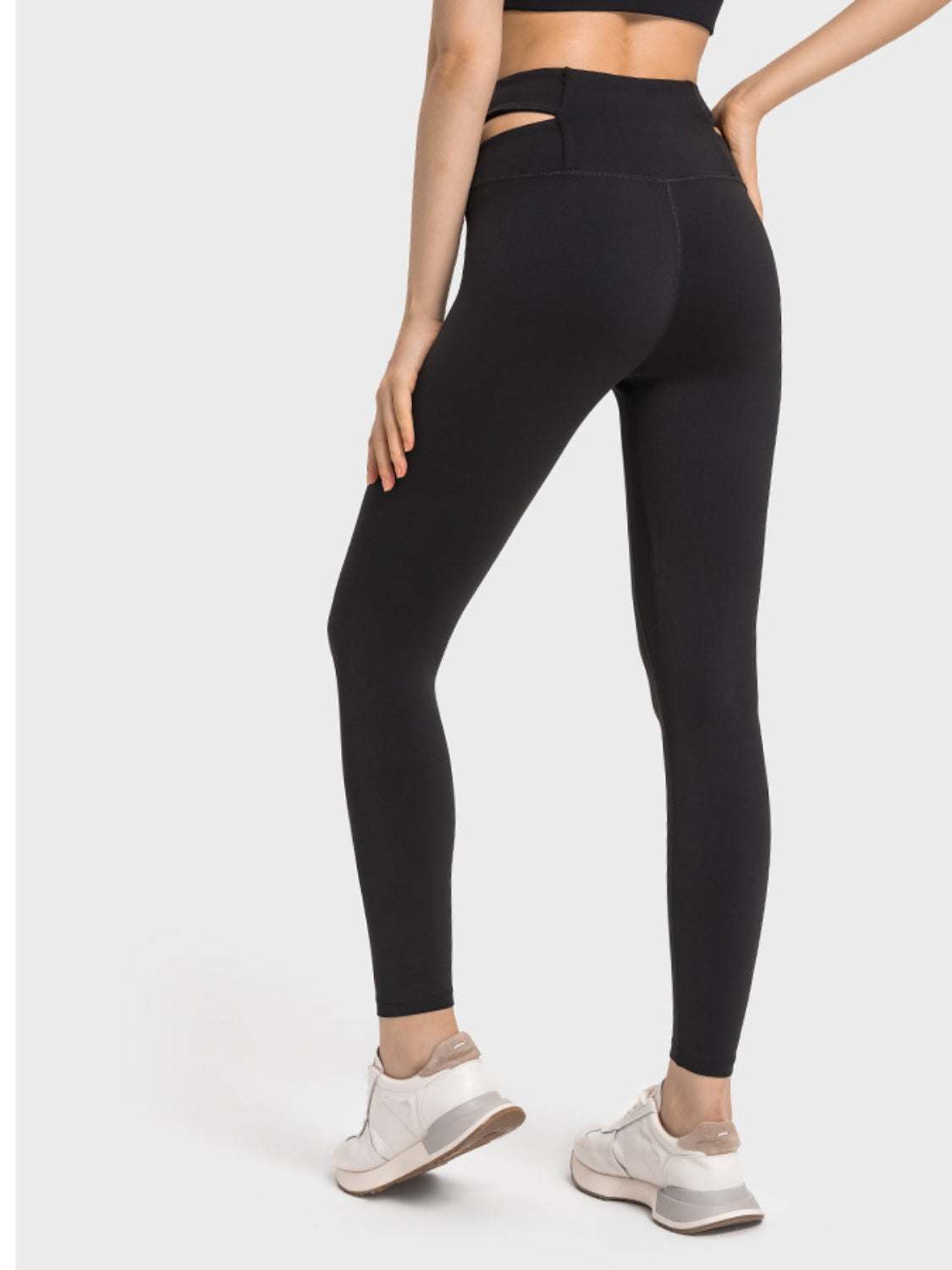 Black Millennia Crisscross Cutout Sports Leggings, stretchy nylon-spandex blend, back view.