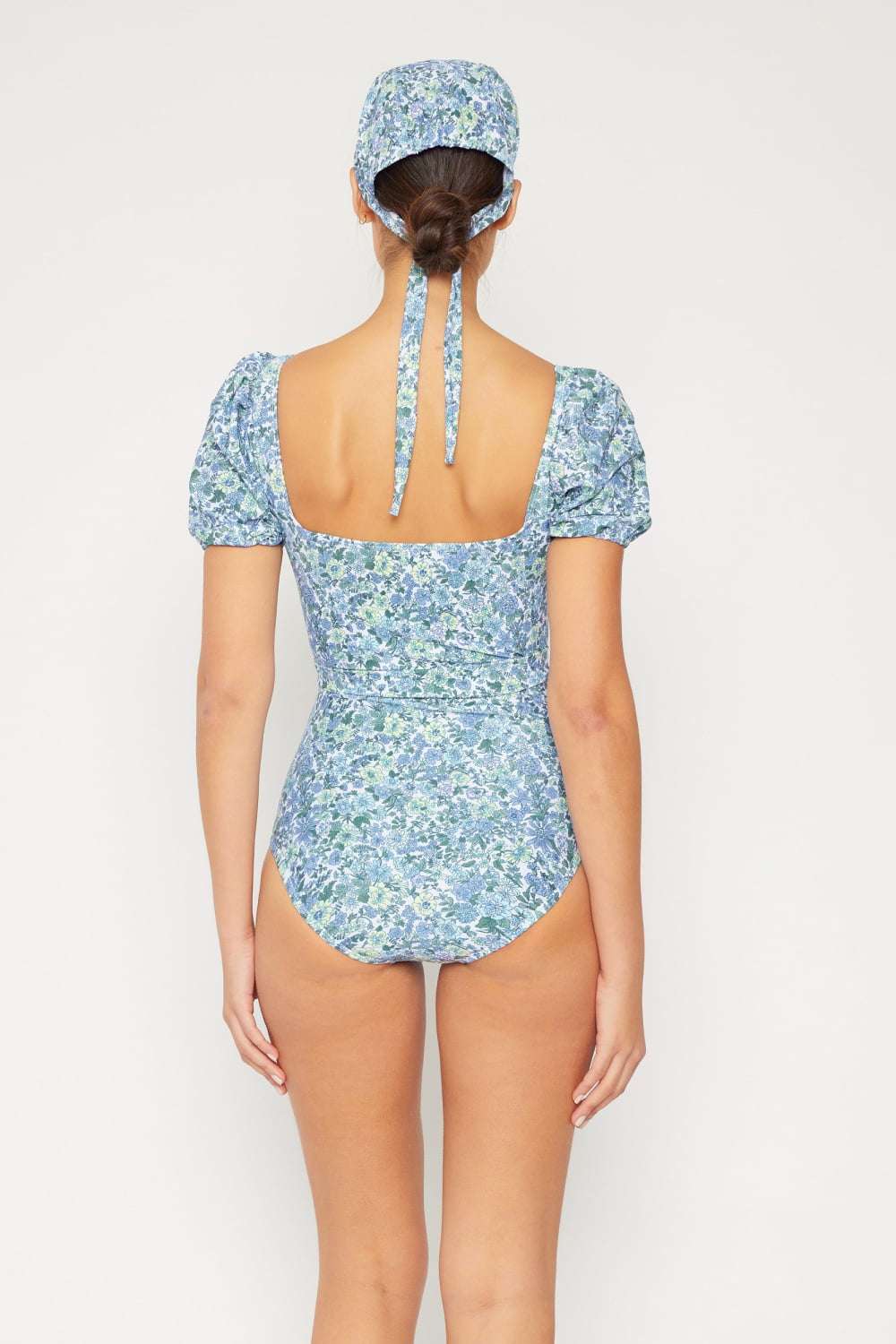 Blue floral one-piece swimsuit with puff sleeves and optional tie belt, Marina West Swim Salty Air.