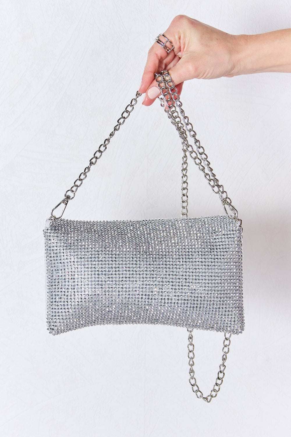 Forever Link Rhinestone Crossbody Bag with sparkling embellishments and chain strap.