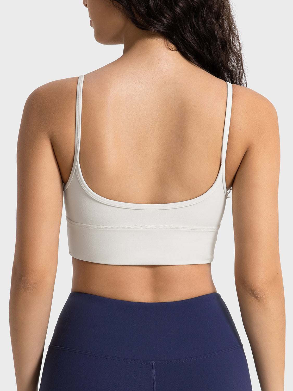 Millennia Spaghetti Strap Sport Bra with removable padding and stretchy material.