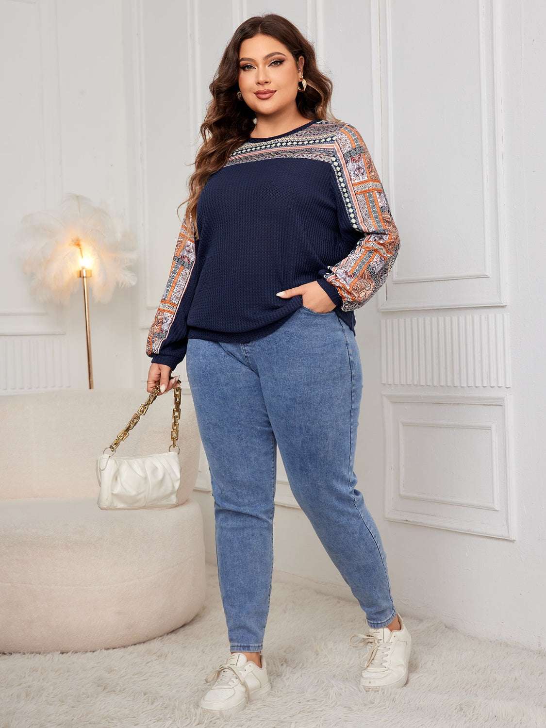 Plus size printed long sleeve sweatshirt, basic style, slightly stretchy material, blue and patterned sleeves.