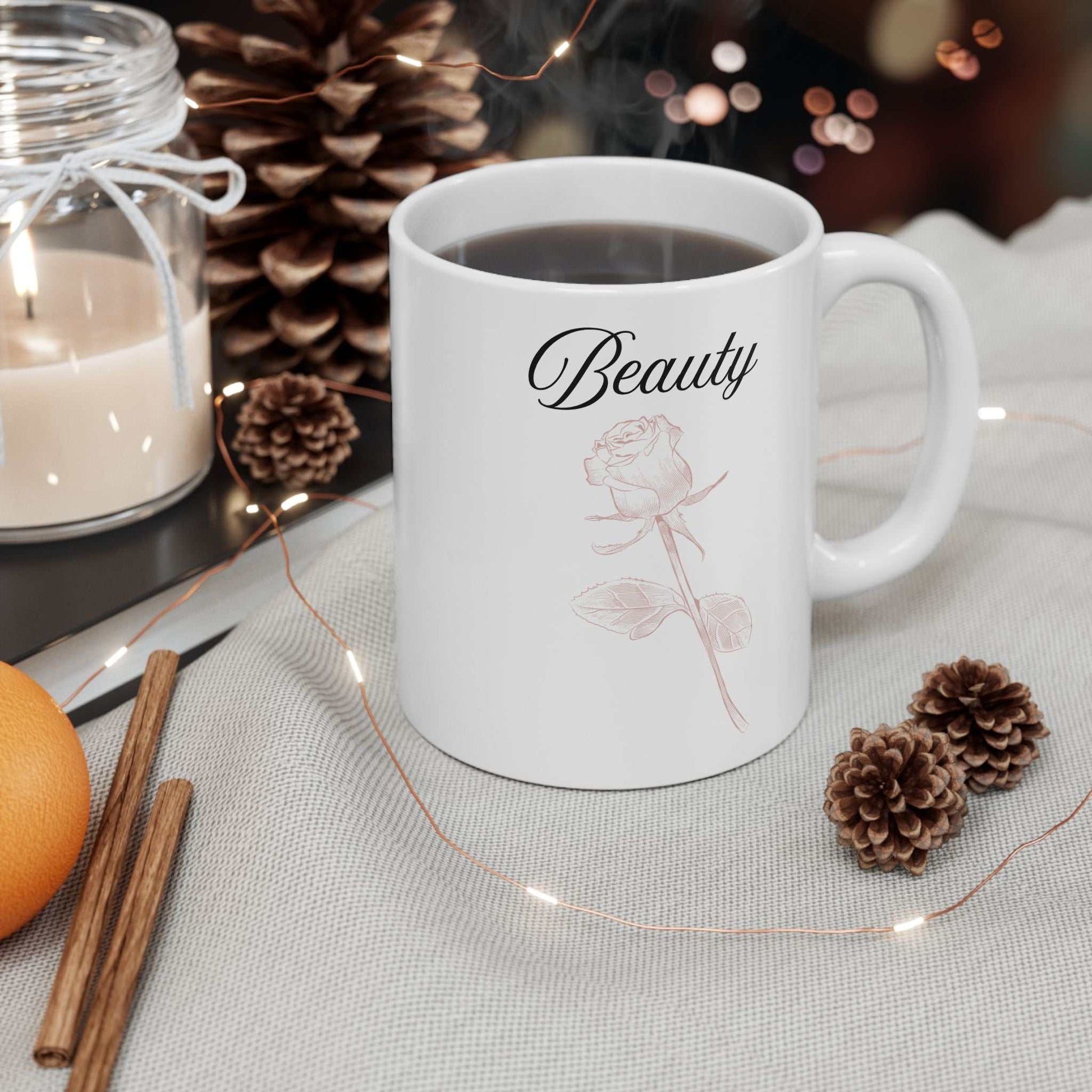 Ceramic mug with 'Beauty' text and dusty rose design, perfect for gifts.