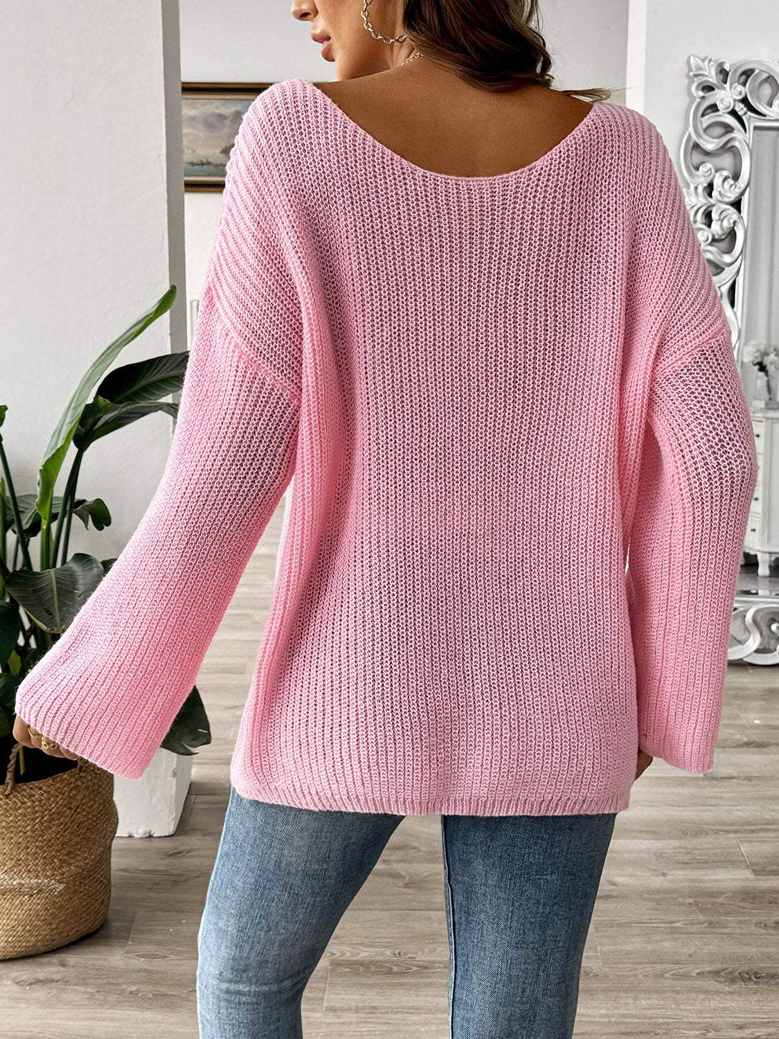 Pink bow boat neck long sleeve sweater, slightly stretchy, 100% polyester.