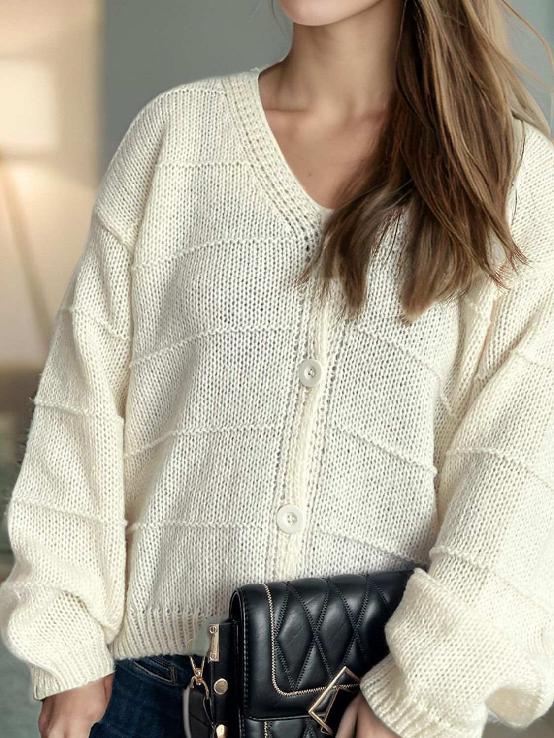 Button Down V-Neck Long Sleeve Cardigan in cream knit with button detail.