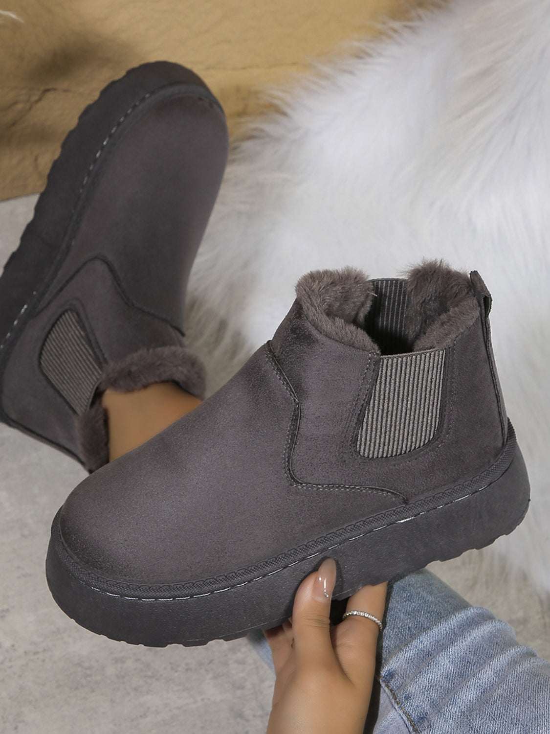 Suede round toe platform boots with faux fur lining and rubber soles.