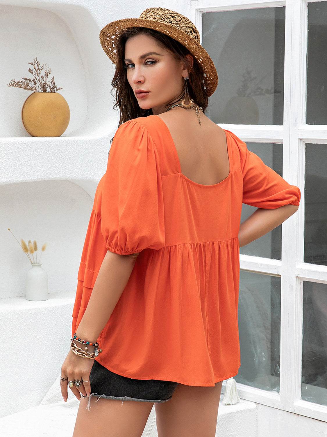 Plus size orange square neck half sleeve blouse made of 100% viscose.