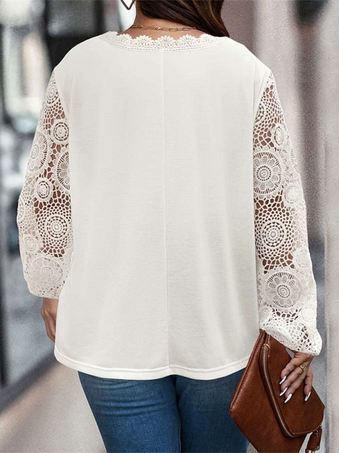 Plus size lace detail V-neck long sleeve T-shirt in white.