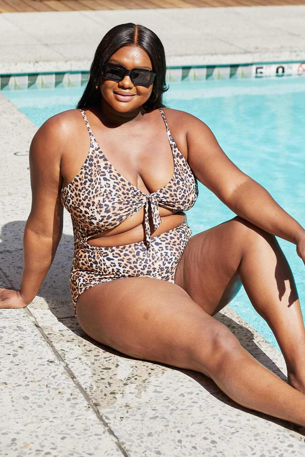 Leopard print cutout one-piece swimsuit with plunge neckline by Marina West Swim.