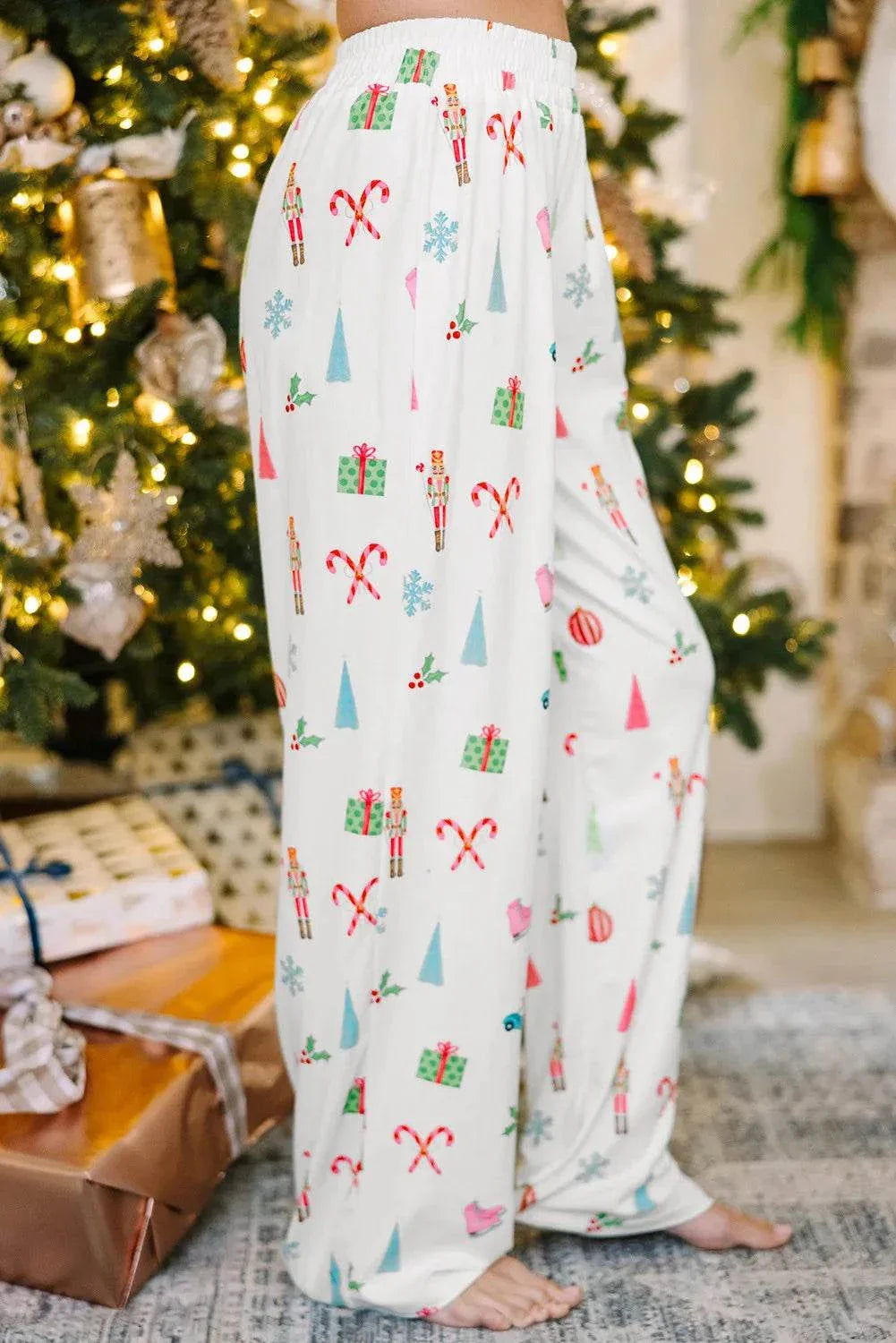 Christmas-themed printed collared neck long sleeve top and pants lounge set with pocketed design, showcasing festive motifs.