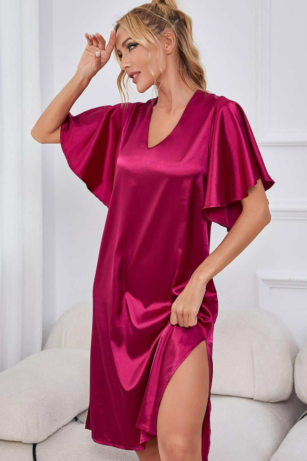 Satin flutter sleeve night dress with side slit and V-neck in solid color.