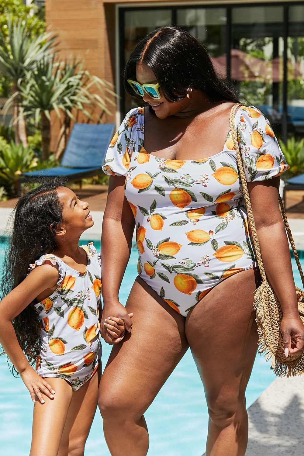 Marina West Swim Salty Air Puff Sleeve One-Piece in Citrus Orange with puff sleeves and citrus print.