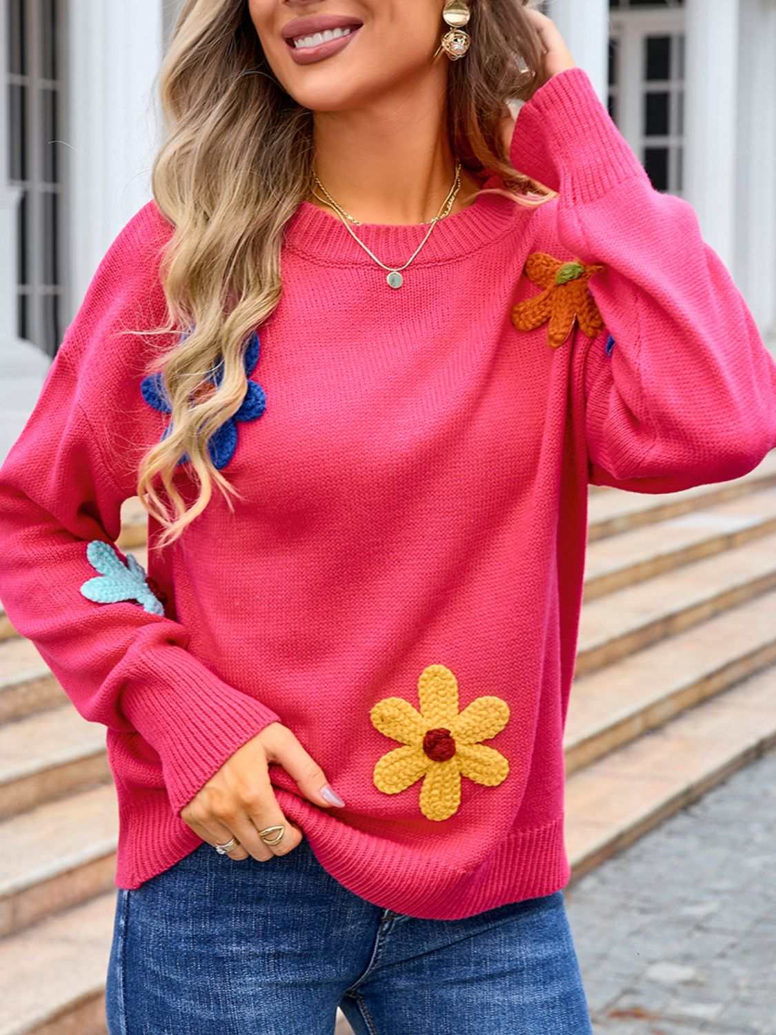 Angel Wings Crochet Flower Round Neck Sweater with colorful floral accents, moderate stretch, 100% acrylic material.