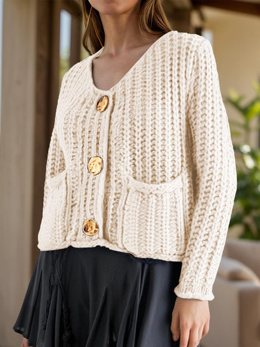 Long sleeve button-down cardigan in cream, featuring a basic style and slightly stretchy acrylic material.