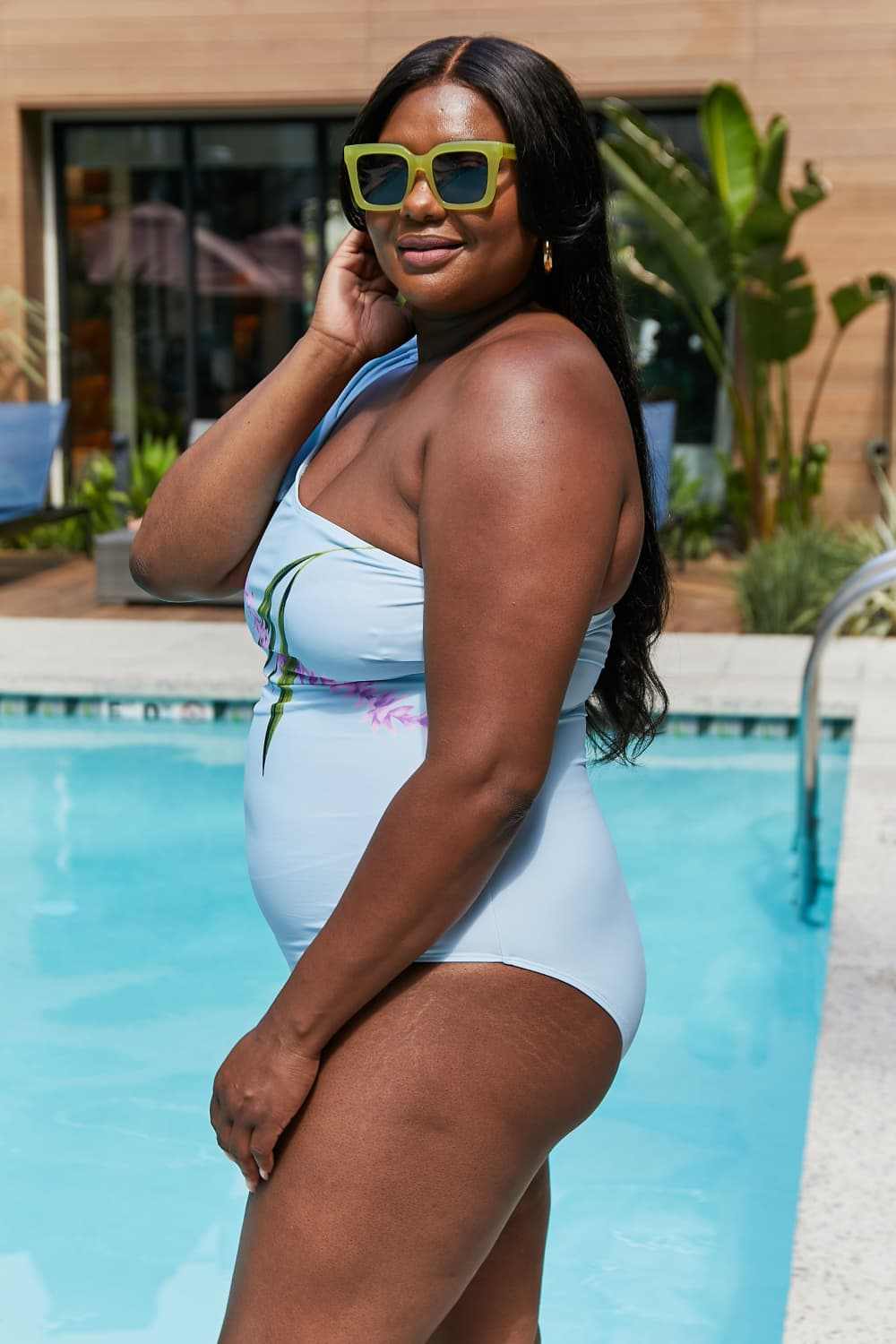 Marina West Swim Vacay Mode one shoulder swimsuit in pastel blue with tie detail, graphic pattern, and ruffle feature.