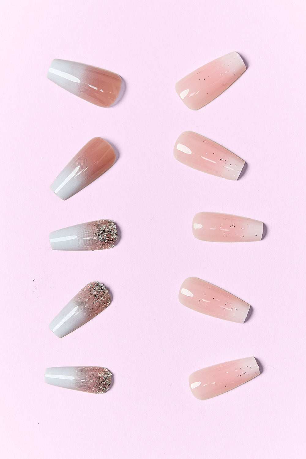 PINK BEAUTY Press On Nails with two distinct designs on a light pink background.