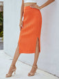 Ribbed side slit midi skirt in orange with solid pattern.