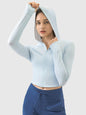 Light blue millennia zip-up hooded long sleeve active outerwear worn by a model.