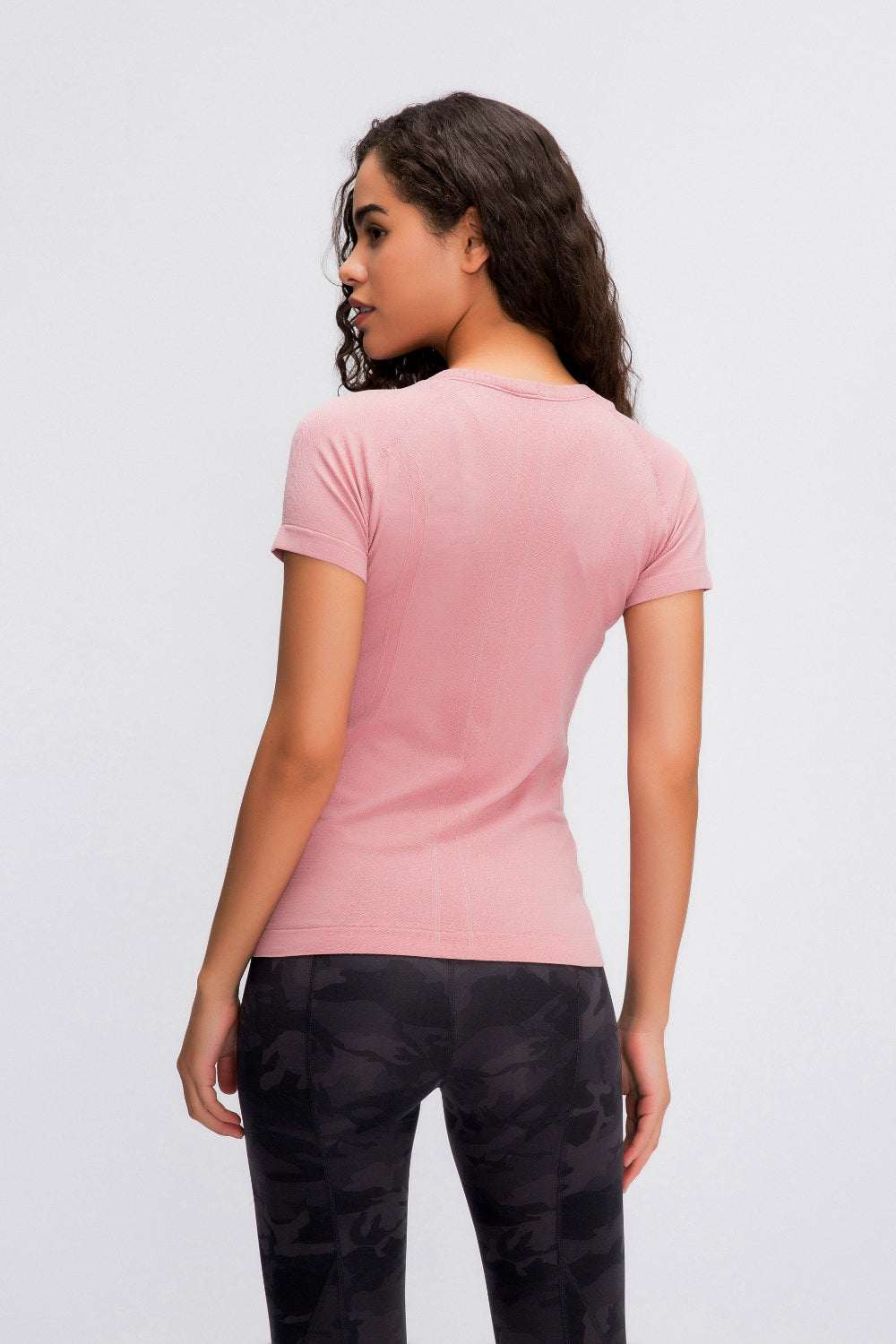 Millennia Round Neck Short Sleeve Active T-Shirt in pink worn by model, back view.