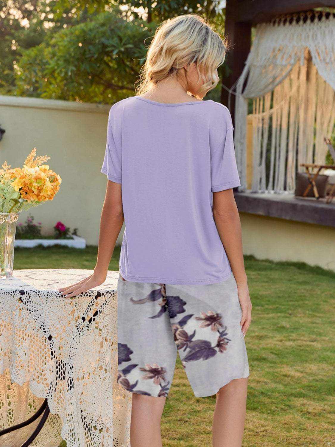 Short sleeve top and printed shorts lounge set, featuring a tied design and slightly stretchy polyester material.