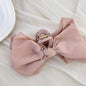 Bow Hair Claw Clip in pink polyester, 5.1 inches, 1.4 oz.